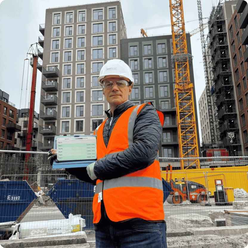 construction employee time tracking software interface on tablet with construction background